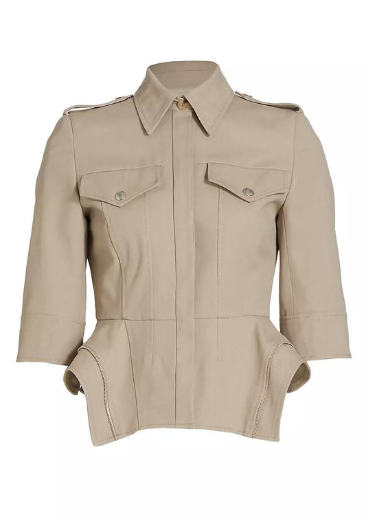 A beige Alexander Macqueen -NEW WITH TAGS jacket by EXCHANGE, featuring a collared neckline, buttoned chest pockets, three-quarter sleeves, and flared structured hip detailing for a luxurious touch.