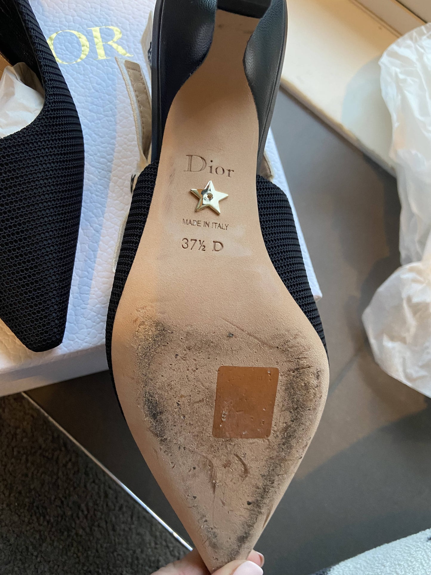 A close-up of the sole of an EXCHANGE Dior J’adior Slingback in size 37½, showing scuff marks, dirt, Dior branding, a star-shaped stud, and MADE IN ITALY 37½ D markings.