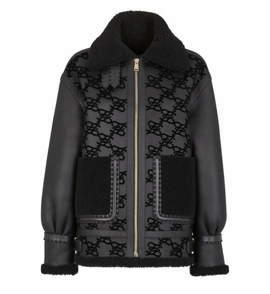 The Fendi Jacket by EXCHANGE is a black shearling aviator with a large collar, front zipper, two front pockets, all-over monogram pattern, and leather trim on the cuffs and pockets.