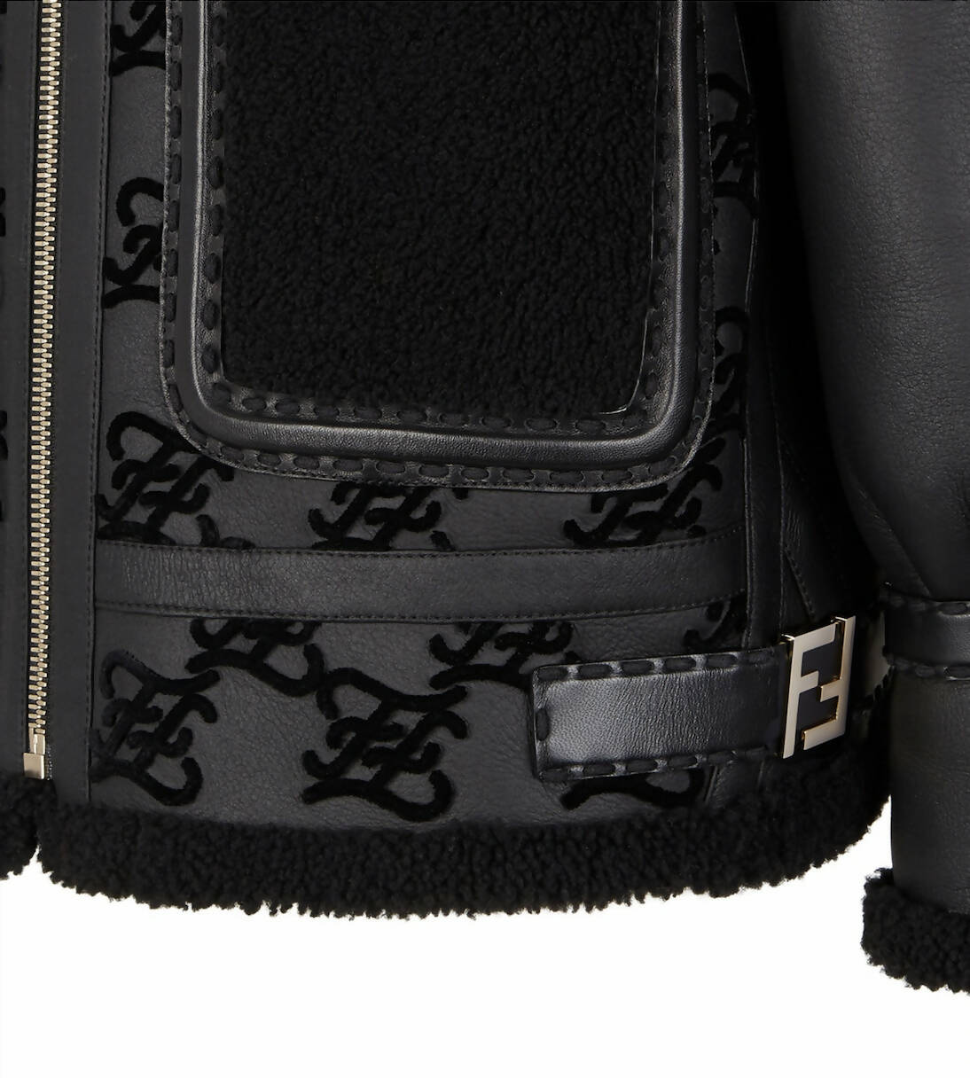 Close-up of the EXCHANGE Fendi Jacket, a black shearling aviator featuring textured trim, embossed “FF” logos throughout, and a metallic “F” buckle detail near the hem.