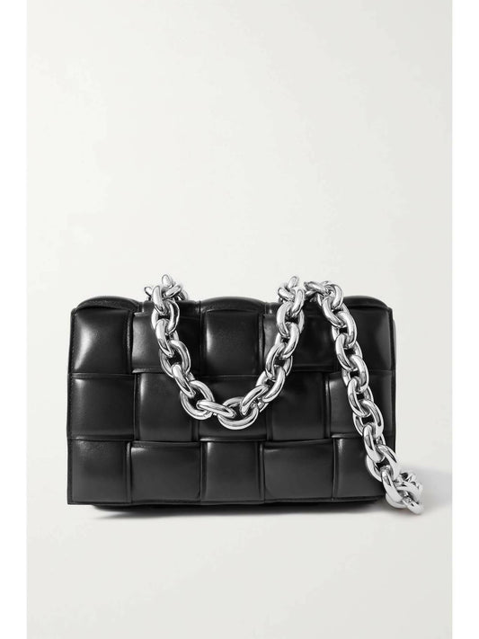 The EXCHANGE BOTTEGA VENETA Cassette chain-embellished black quilted leather handbag, 15cm and barely used, features large rectangular stitching and a chunky silver chain strap, shown on a plain white background.