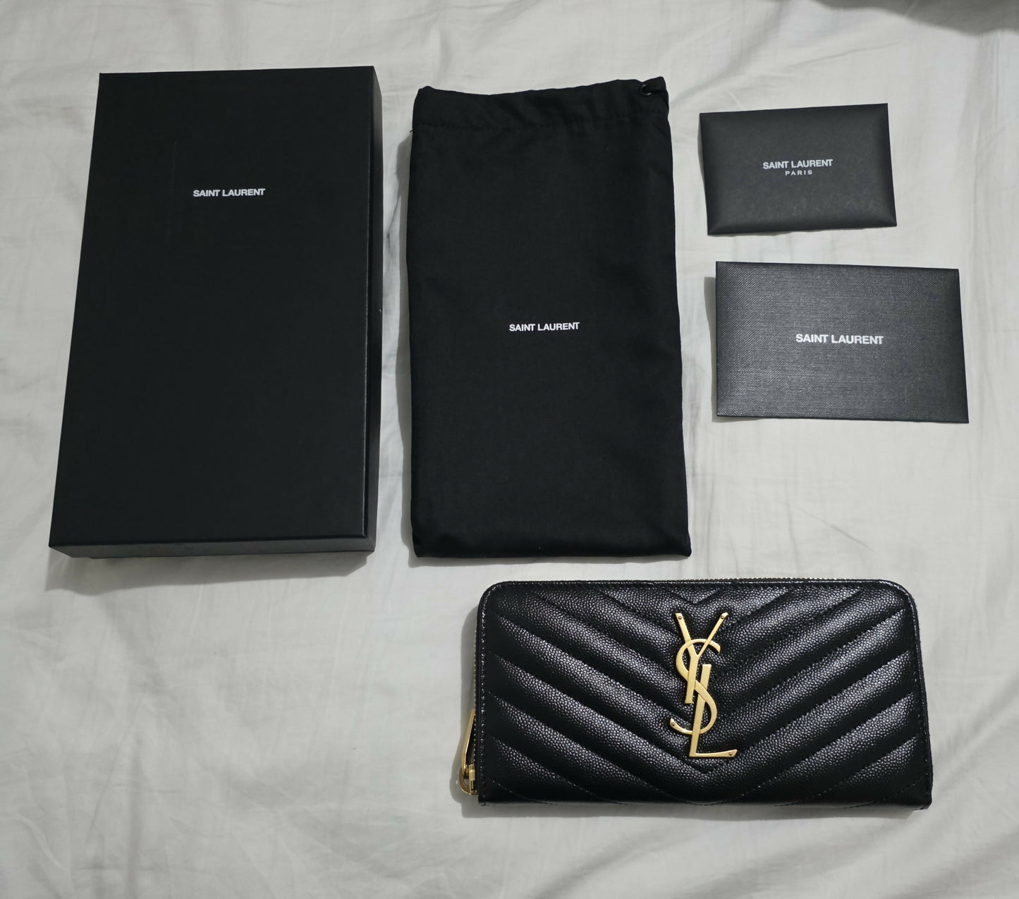 SAINT LAURENT CASSANDRE MATELASSÉ ZIP AROUND WALLET