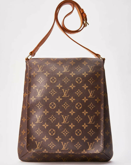A Louis Vuitton Monogram Musette crossbody bag, authenticated by EXCHANGE, features the classic LV monogram, floral patterns, tan leather strap, and gold-tone hardware—shown on a plain white background.