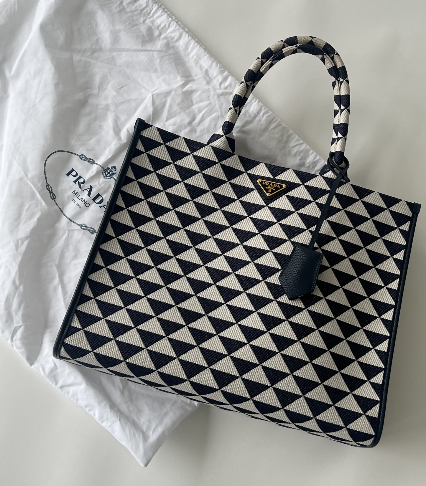 Large Prada Symbole embroidered fabric handbag